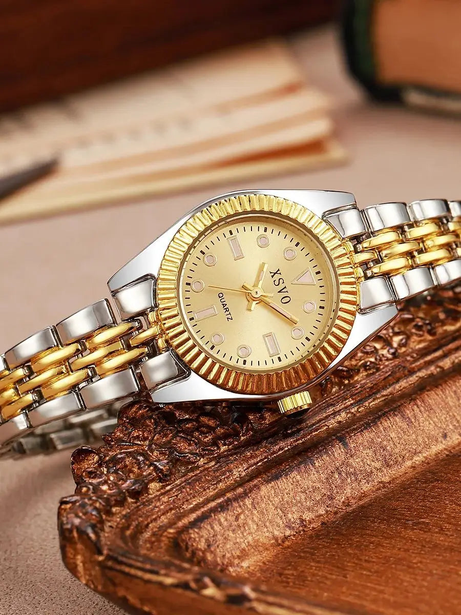 Luxury Two-Tone Women's Watch displayed on a wooden surface, showcasing its gold and silver alloy band and elegant design.